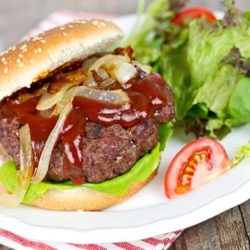 Hamburger with salad Stock Photos