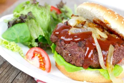 Hamburger with salad Stock Photos