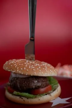Hamburger served on red table Stock Photos