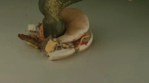Hamburger smashed by hammer Stock Footage 11005491