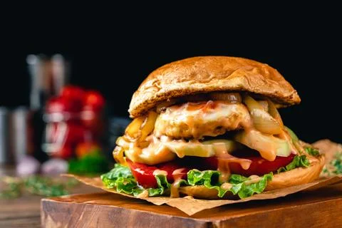 Hamburger stuffed with fried egg Stock Photos
