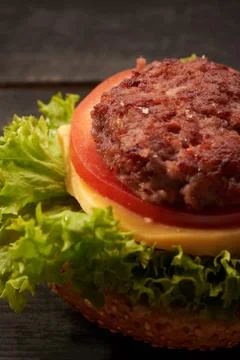 Hamburger on a wooden table Stock Photos