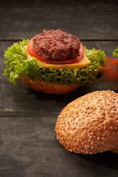 Hamburger on a wooden table Stock Photos