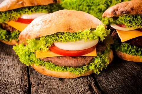 Hamburgers on table Stock Photos