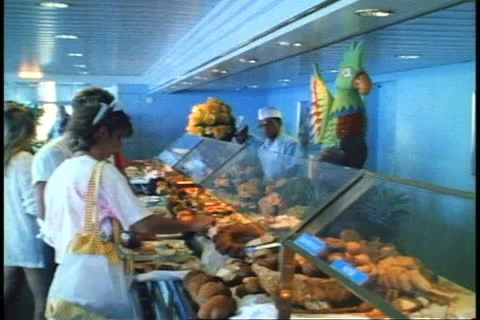HAMILTON, BERMUDA, 1994, Lunch buffet with crowd and chefs on a cruise ship Stock Footage 12249958
