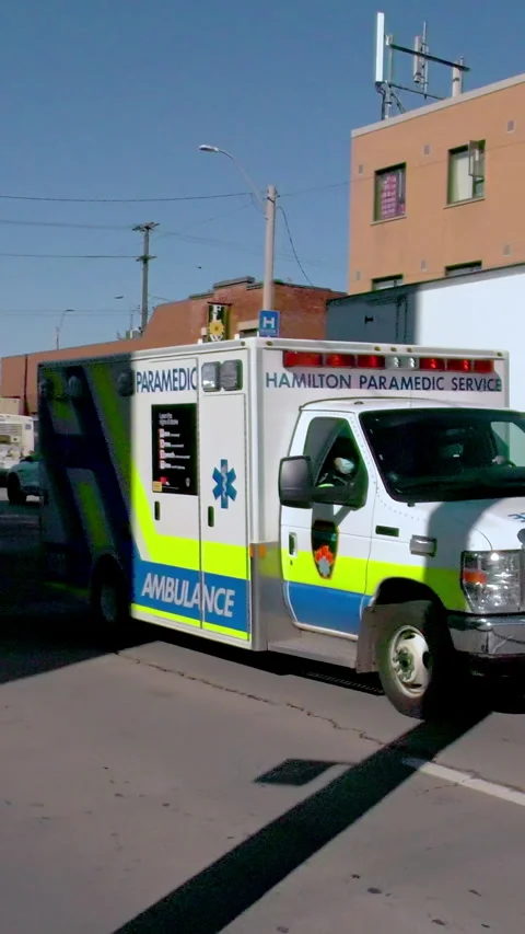 Hamilton, Canada - May 1, 2021: Ambulance, paramedics with flashing lights Video stock 281297591