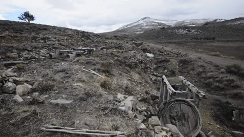 Hamilton, Nevada; old mining machinery scattered beneath Treasure Mountain Video stock 154775295