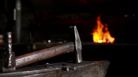 Hammer against the fire, a blacksmith preparing at work Stock Footage 87725282