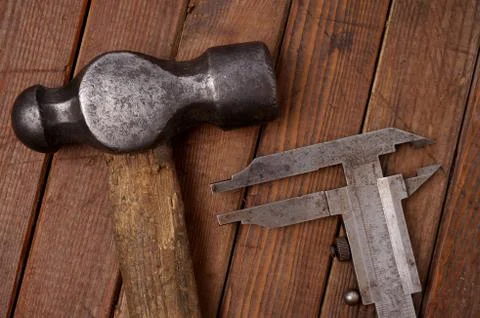 Hammer and caliper Stock Photos