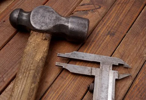 Hammer and caliper Stock Photos