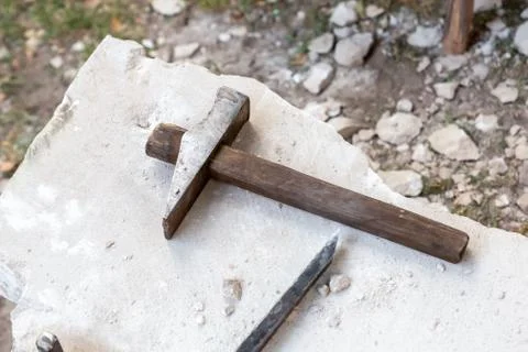 Hammer and chisel of the quarry, processing and extraction of stone Stock Photos