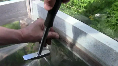 Hammer and nail Stock Footage 24695700