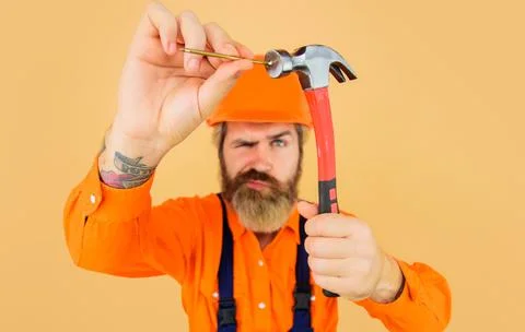 Hammer and nails. Builder hammering nail. Repairman with Repairment tools. Se Stock Photos