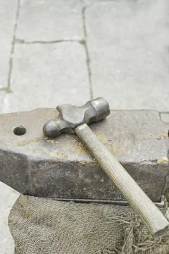Hammer anvil artisan workshop work and profession Stock Photos