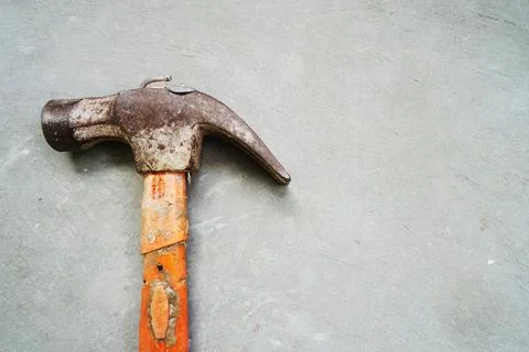 Hammer on cement background Stock Photos