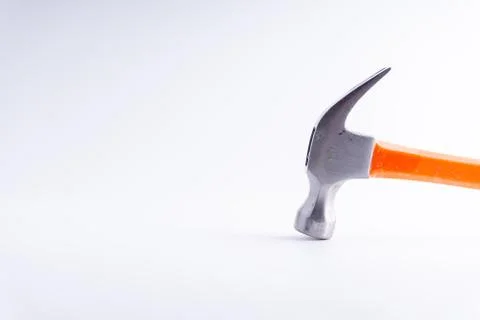 Hammer closeup on white background with selective focus and crop fragment Fotos de archivo