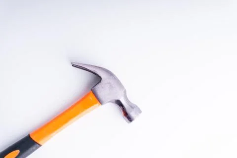 Hammer closeup on white background with selective focus and crop fragment 库存照片