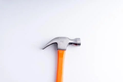 Hammer closeup on white background with selective focus and crop fragment Stock-Fotos