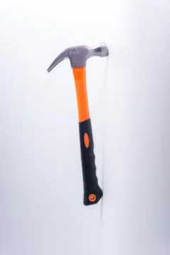 Hammer closeup on white background with selective focus and crop fragment 库存照片