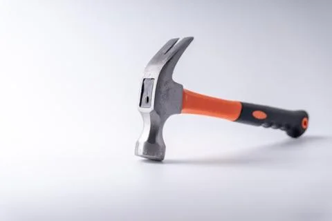 Hammer closeup on white background with selective focus and crop fragment Fotos Stock