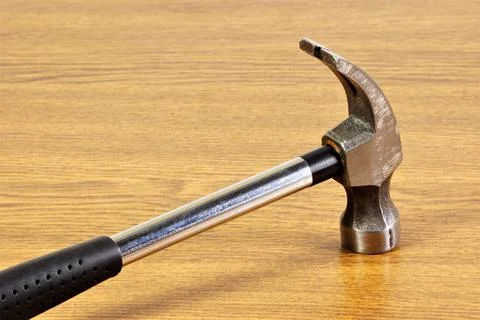 Hammer is a construction locksmith tool for hammering fastening nails. Stock Photos