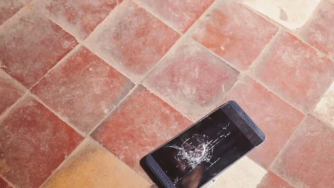 Hammer crash hitting a smartphone, broken touch screen glass slow motion rapid Video stock 83830737