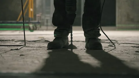 Hammer Drill Breaking Through Concrete Floor Видео 343371174