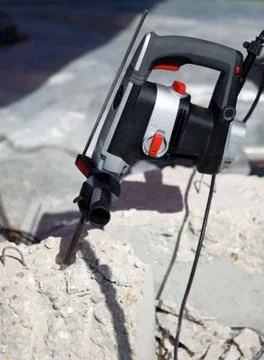 Hammer drill in concrete brick Stock Photos