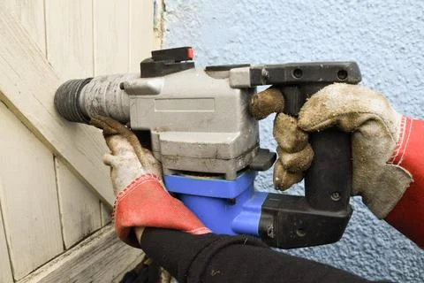 Hammer Drill Power Tool Close Up on Construction Site Stock Photos