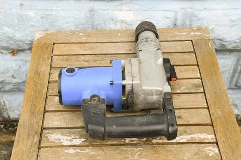 Hammer Drill Power Tool Close Up on Construction Site Photos
