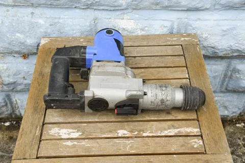 Hammer Drill Power Tool Close Up on Construction Site Stock Photos