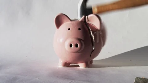 Hammer exploding piggy bank Stock Footage 82880802