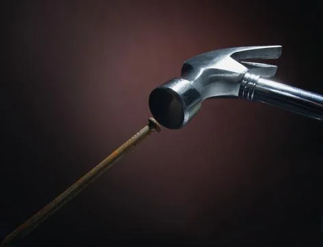 Hammer Hitting The Nail Stock Photos