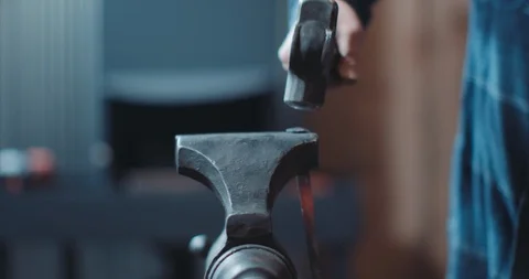 Hammer on iron anvil Stock Footage 105307195