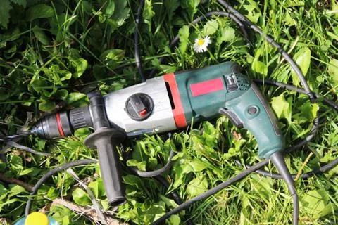 The hammer is lying on the grass Stock Photos