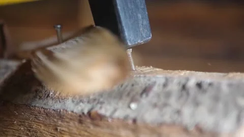 Hammer nails into an old board. Stock Footage 157776656
