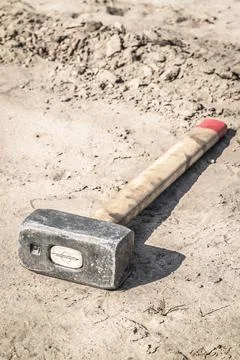 Hammer on the sand Stock Photos