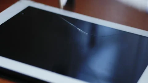 Hammer smashes a computer tablet in slow motion Stock Footage 133163245