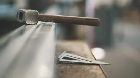 Hammer on a table Stock Footage 137525647