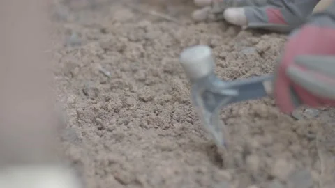 A hammer is used to soften the soil Stock Footage 144294180