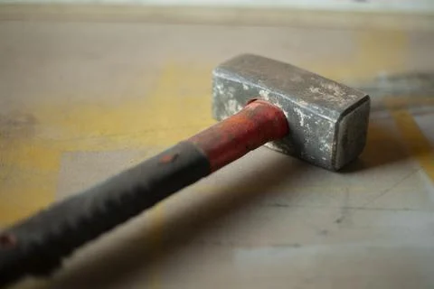 Hammer in workshop. Sledgehammer for work. Tools in garage. Old manual tool.  Stock Photos