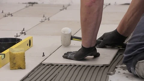 Hammer,ceramic tiles, cement adhesive Stock Footage 111866149