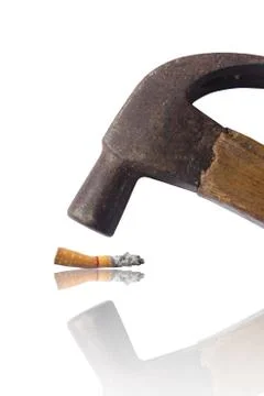 Hammered cigarette isolated on white, hate and anti concept. Stock Photos