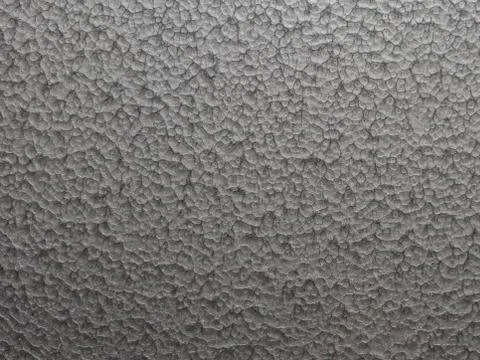 Hammered effect silver grey painted steel plate Stock Photos