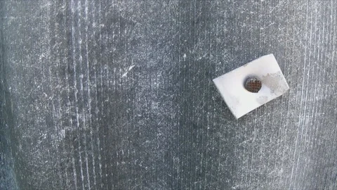 A hammered nail in a striped slate Video stock 178831392