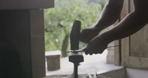 Hammering on anchor with outside door view Stock Footage 141361808