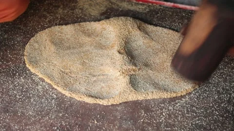 Hammering Beating Mixed Dough Of Roasted Seasame Seeds Stock Footage 166179274