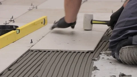 Hammering ceramic tiles Stock Footage 111866159