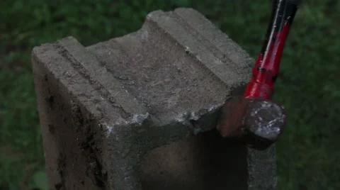 Hammering a Cinderblock Stock Footage 68853572