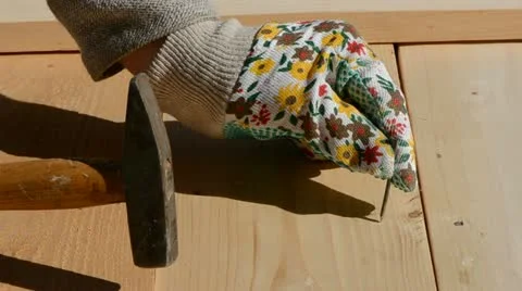 Hammering a nail in new panel Stock Footage 11805700